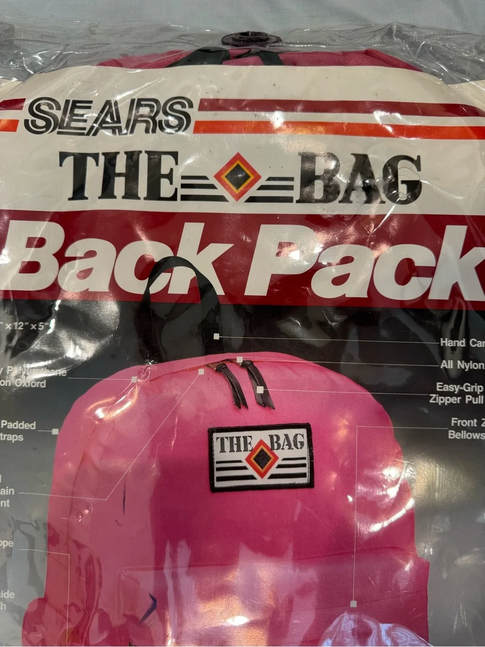 Vintage 1980s Sears “The Bag” backpack in bright pink, Model #98063.